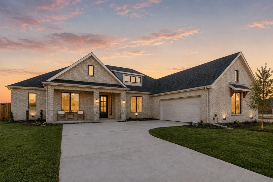 Front exterior of a new home in Kentsdale Farms, DeSoto, TX, highlighting curb appeal (Image 2).