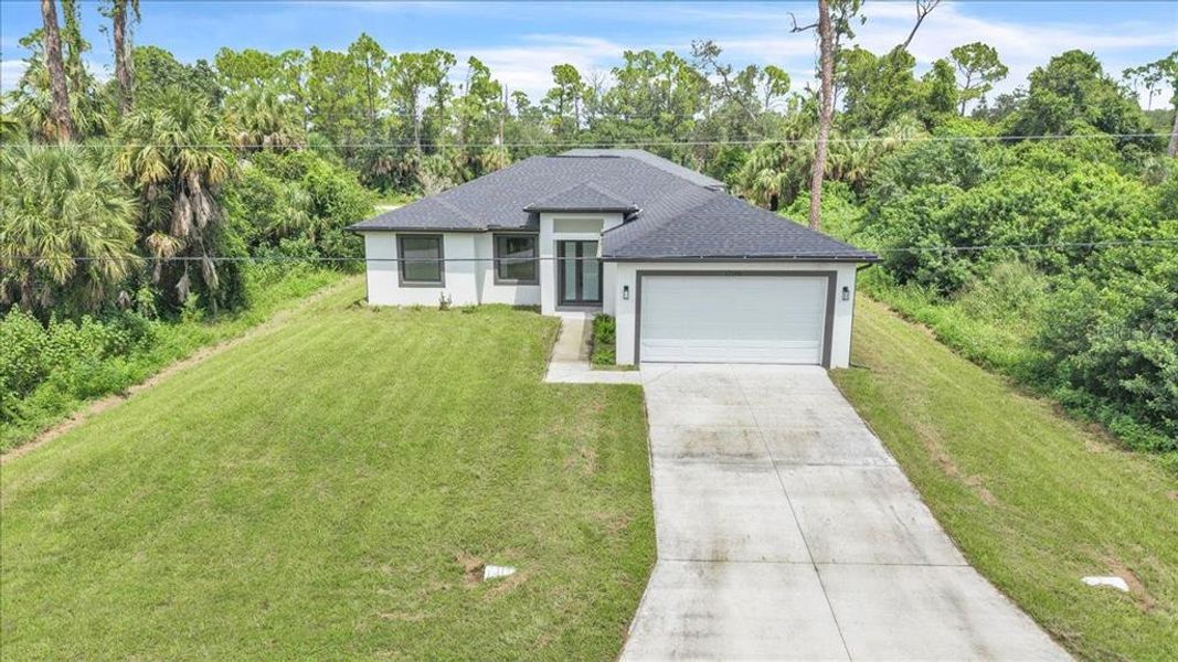 Front exterior of a new home in , Port Charlotte, FL, highlighting curb appeal (Image 22).