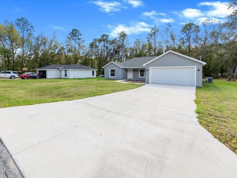 Front exterior of a new home in , Ocala, FL, highlighting curb appeal (Image 20).