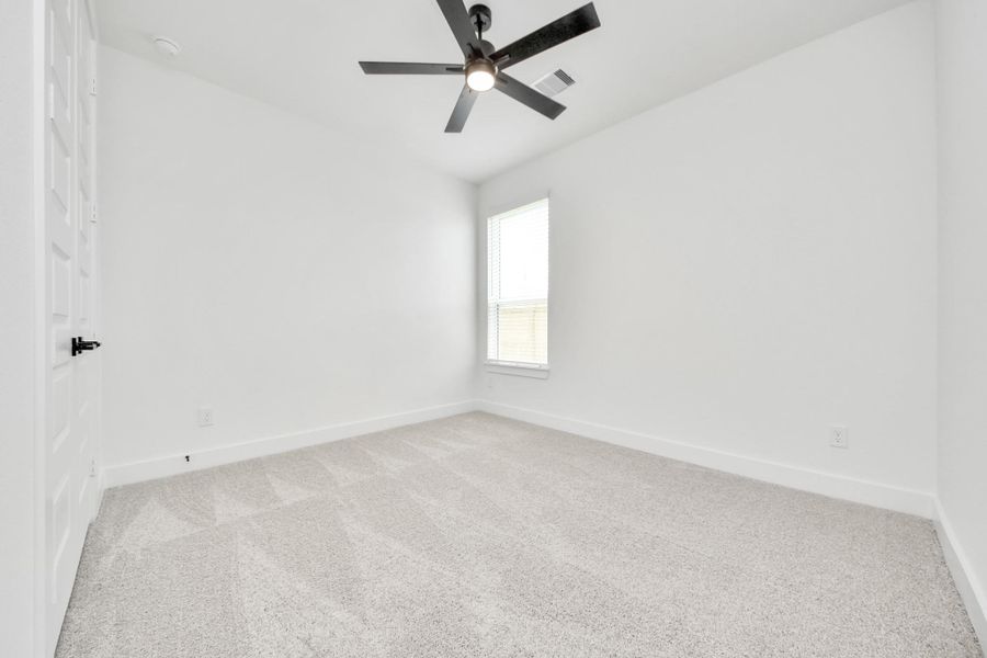 Secondary bedroom features plush carpeting, large windows that let in plenty of natural light, bright paint, and spacious closets. Secondary bedroom features plush carpeting, large windows that let in plenty of natural light, bright paint, and spacious closets.