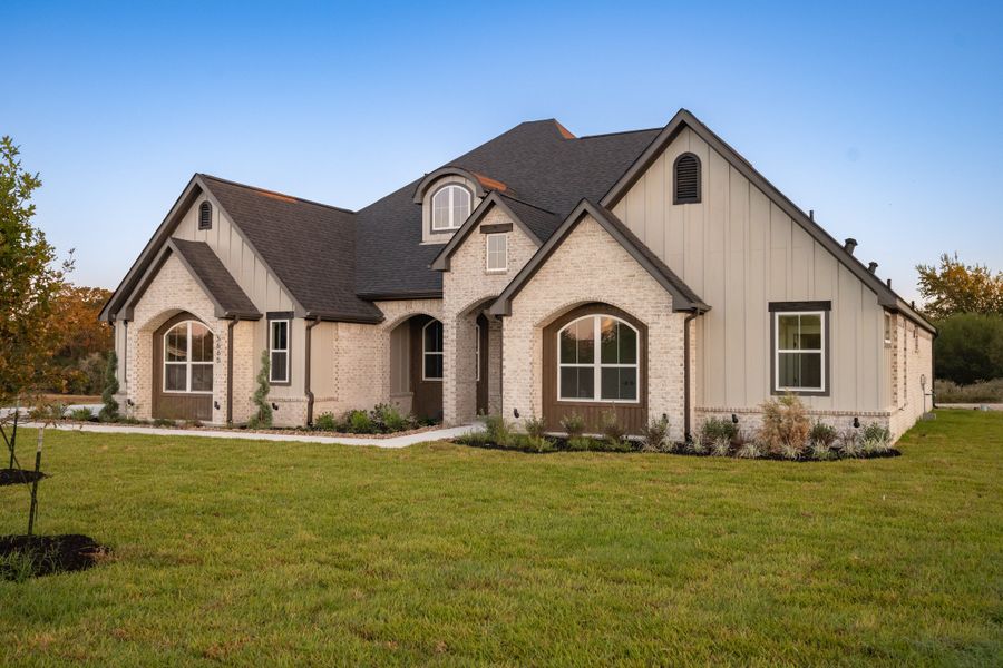 Representative exterior photo of a completed home built from the The Sophie by Reece Homes in Traditions, Bryan, TX (Image 32).