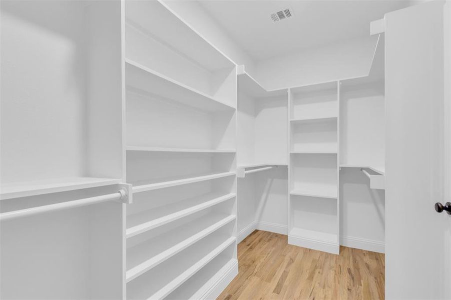 Walk in closet featuring light wood-style floors