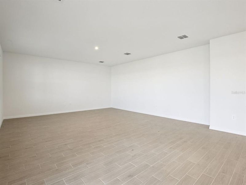 Spacious, unfurnished interior of a new home in Coasterra - Reserve Series, Palmetto (Image 17).