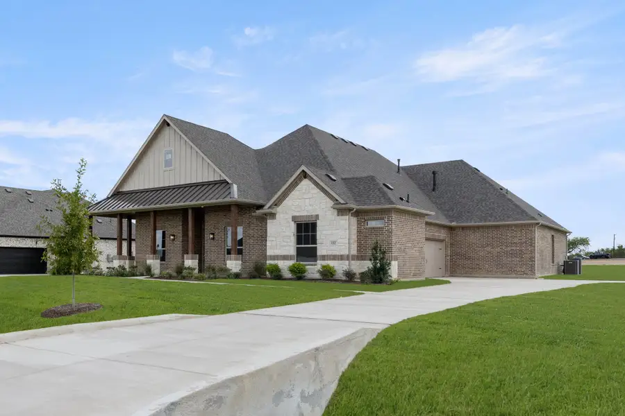 Front exterior of a new home in Settler's Glen, New Fairview, TX, highlighting curb appeal (Image 1). Front exterior of a new home in Settler's Glen, New Fairview, TX, highlighting curb appeal (Image 1).