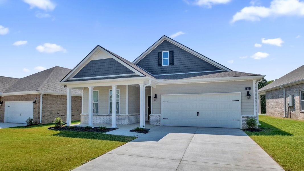 Front exterior of a new home in The Orchard, Millington, TN, highlighting curb appeal (Image 2). Front exterior of a new home in The Orchard, Millington, TN, highlighting curb appeal (Image 2).