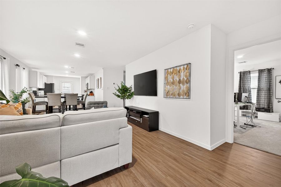 This bright and inviting living room is the heart of this modern open-concept home that was designed with both comfort and style in mind This bright and inviting living room is the heart of this modern open-concept home that was designed with both comfort and style in mind