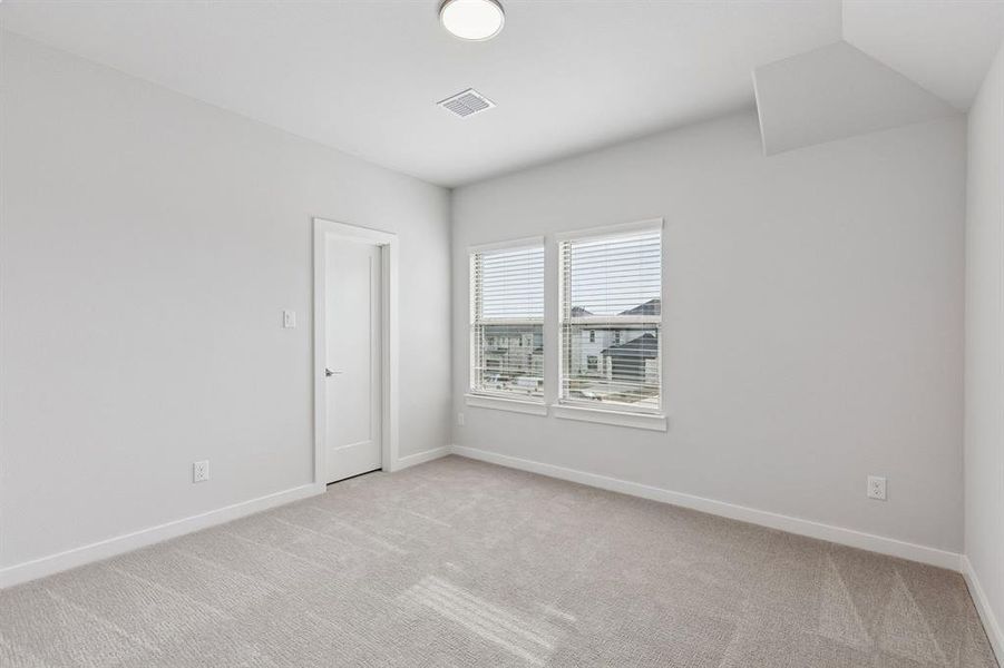 Bedroom in the Stanley II home plan by Trophy Signature Homes – REPRESENTATIVE PHOTO