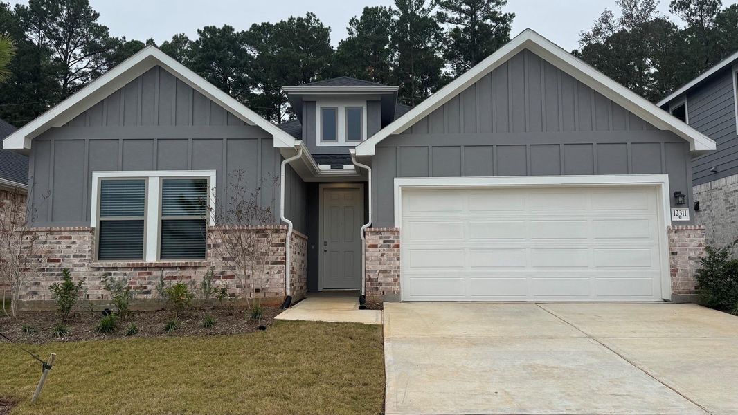 Front exterior of a new home in Westridge Cove, Conroe, TX, highlighting curb appeal (Image 2). Front exterior of a new home in Westridge Cove, Conroe, TX, highlighting curb appeal (Image 2).