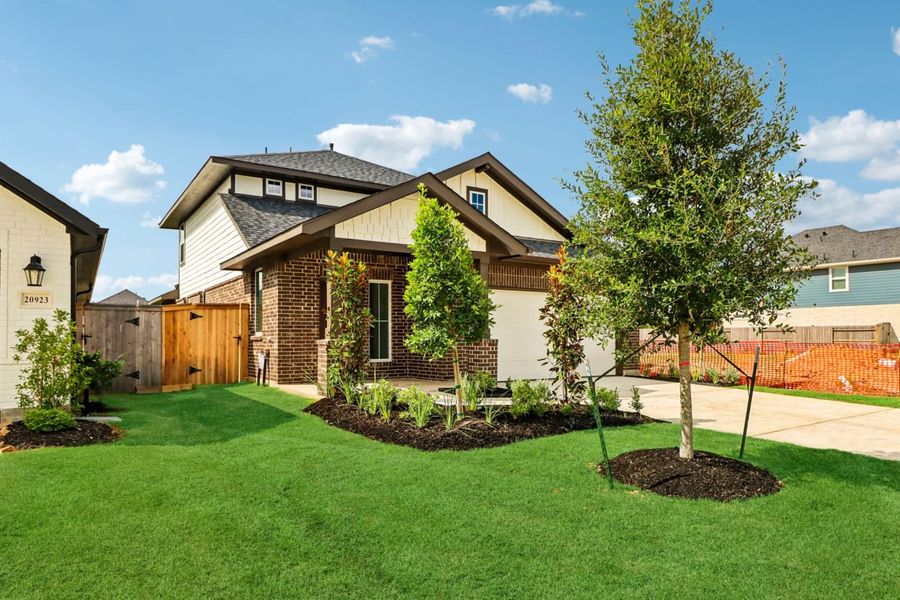 Front exterior of a new home in Sorella, Tomball, TX, highlighting curb appeal (Image 2). Front exterior of a new home in Sorella, Tomball, TX, highlighting curb appeal (Image 2).