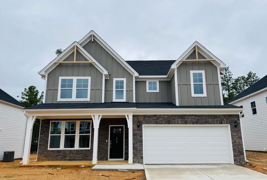 Front exterior of a new home in Pebble Branch, Chapin, SC, highlighting curb appeal (Image 1).