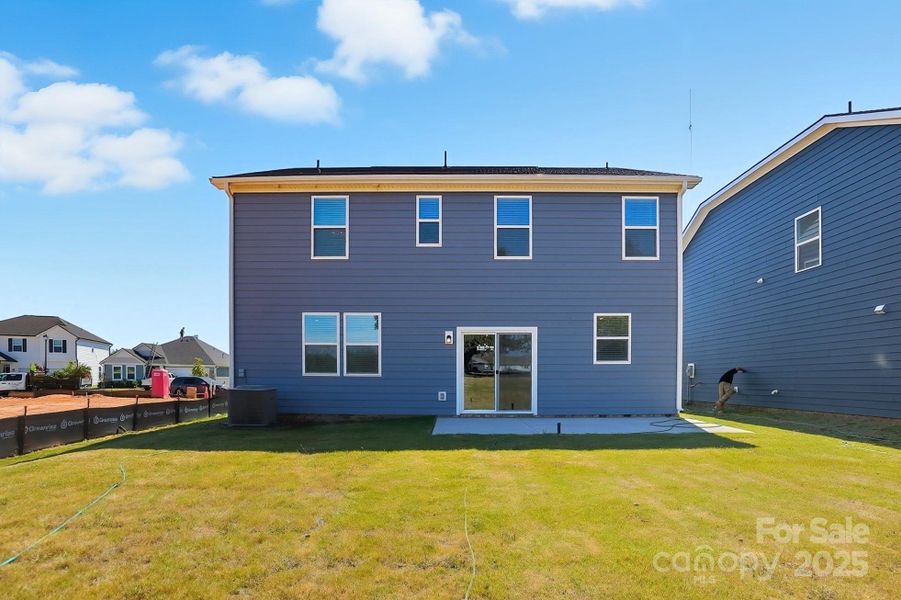 Exterior details and patio area of a home in Wellington Pointe Classic Series, Monroe (Image 1).