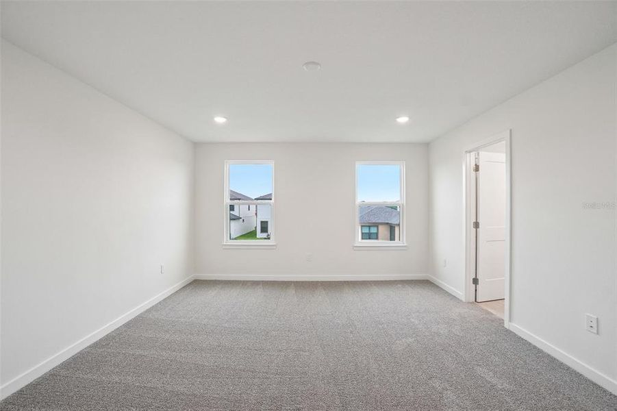Spacious, unfurnished interior of a new home in Grasslands West, Lakeland (Image 37).