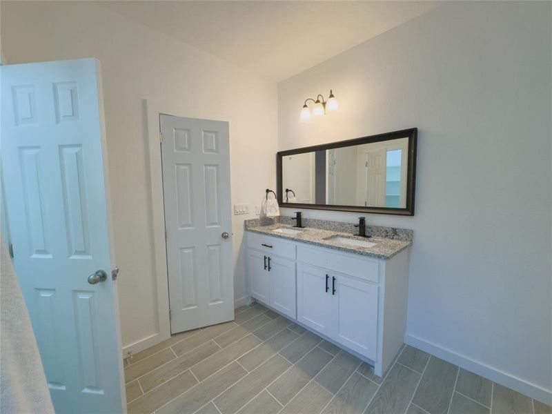 Bathroom featuring double vanity