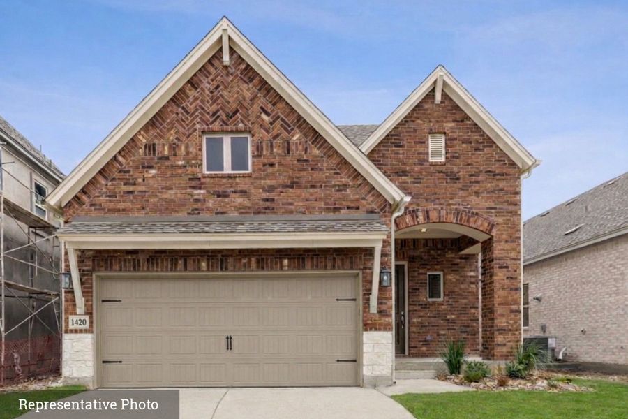 Front exterior of a new home in South Brook, Leander, TX, highlighting curb appeal (Image 1). Front exterior of a new home in South Brook, Leander, TX, highlighting curb appeal (Image 1).
