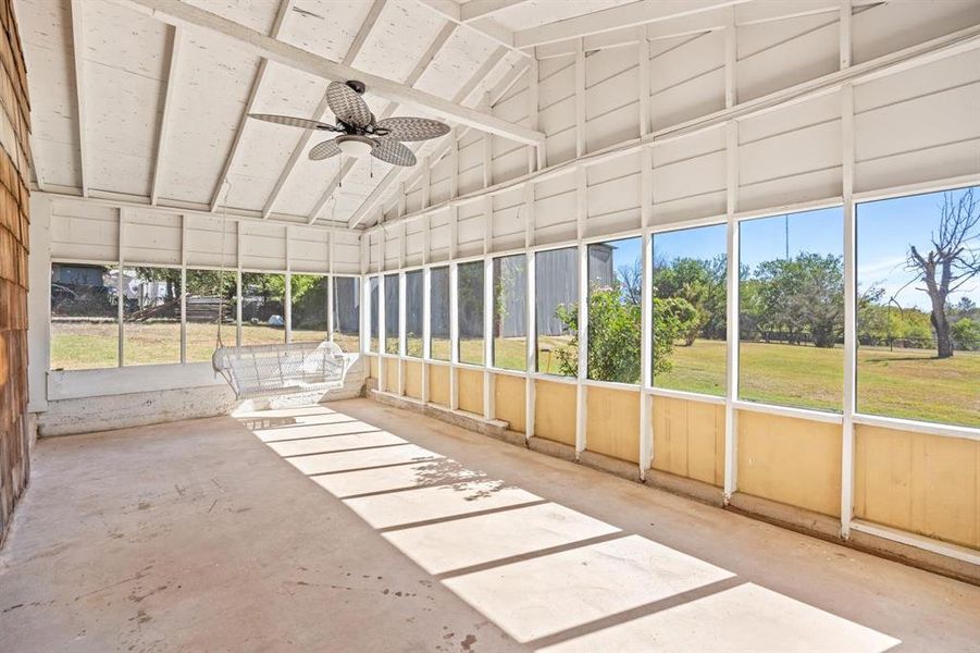 Screened Porch with lofted ceiling and ceiling fan