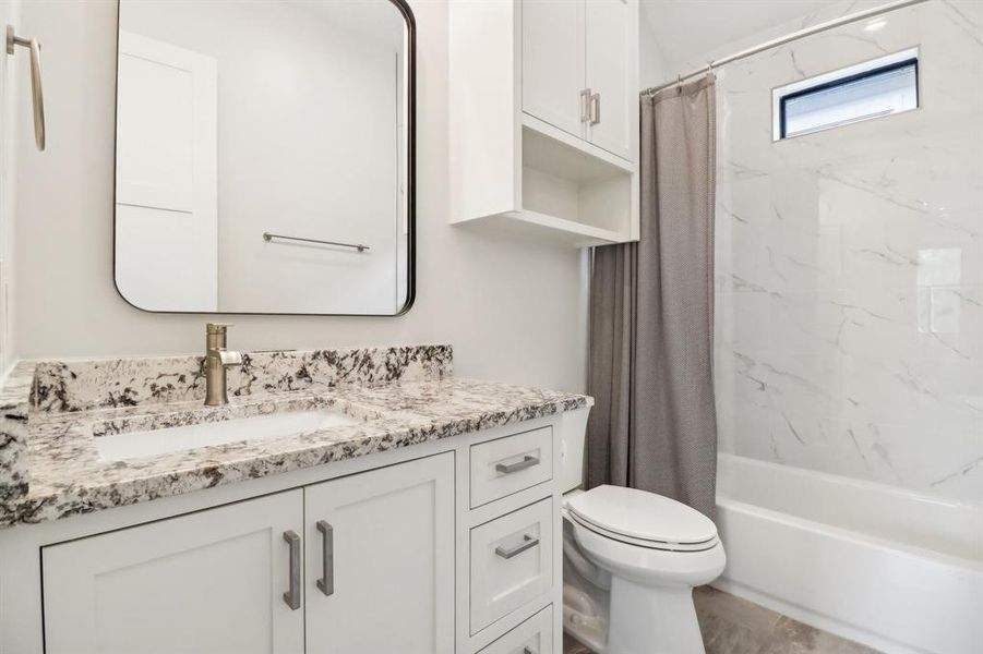 En-suite bathroom with a tub/shower combo.