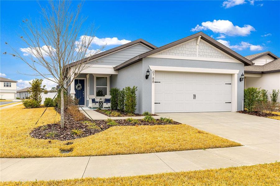 Front exterior of a new home in Pioneer Ranch, Ocala, FL, highlighting curb appeal (Image 22).