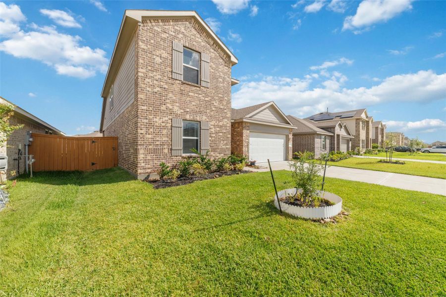 Exterior details and patio area of a home in Sunterra, Katy (Image 1).