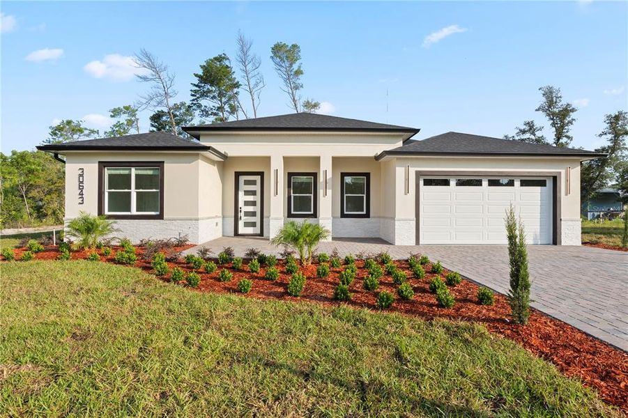 Front exterior of a new home in , Eustis, FL, highlighting curb appeal (Image 25). Front exterior of a new home in , Eustis, FL, highlighting curb appeal (Image 25).