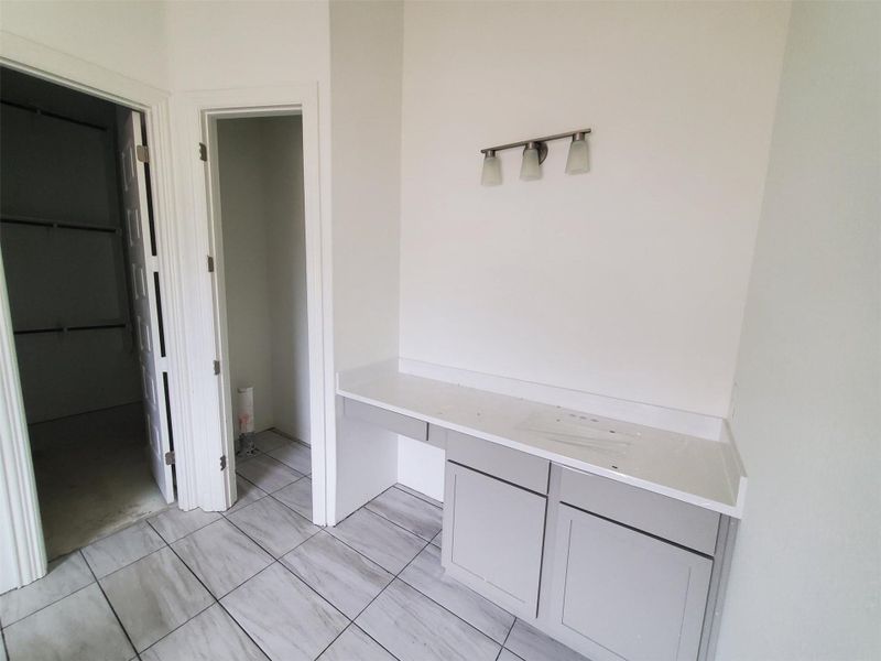 Mudroom with light tile patterned floors