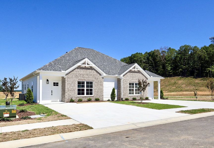 Front exterior of a new home in The Hoback, Cleveland, TN, highlighting curb appeal (Image 2). Front exterior of a new home in The Hoback, Cleveland, TN, highlighting curb appeal (Image 2).