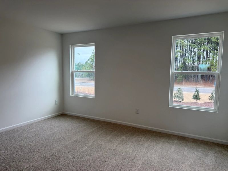 Primary Bed - A sophisticated retreat with style.