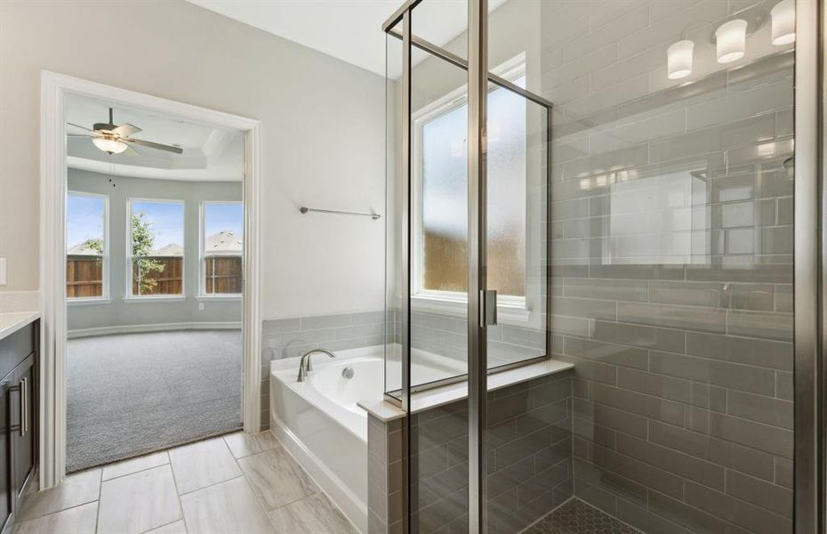 Owner's bath with oversized shower *real home pictured