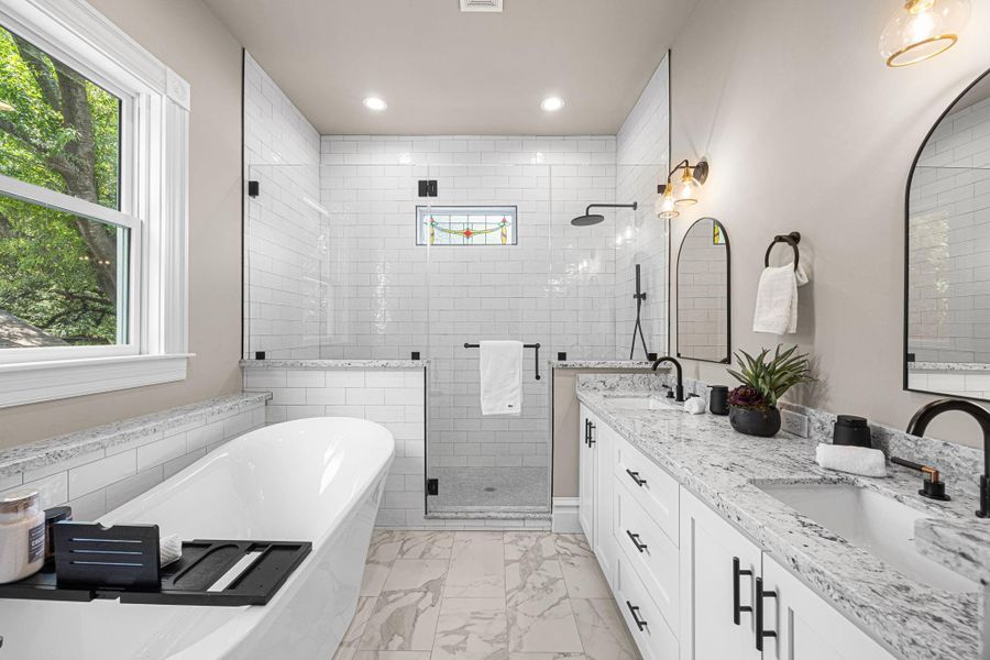 Welcome to the en-suite primary bathroom. Enjoy all of the natural light that illuminates this space throughout the day. Welcome to the en-suite primary bathroom. Enjoy all of the natural light that illuminates this space throughout the day.