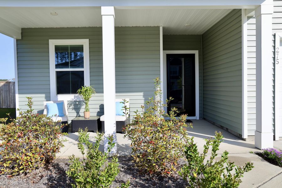 Exterior details and patio area of a home in Sanctuary Cove at Cane Bay, Summerville (Image 22).