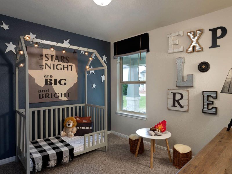 Carpeted bedroom featuring baseboards