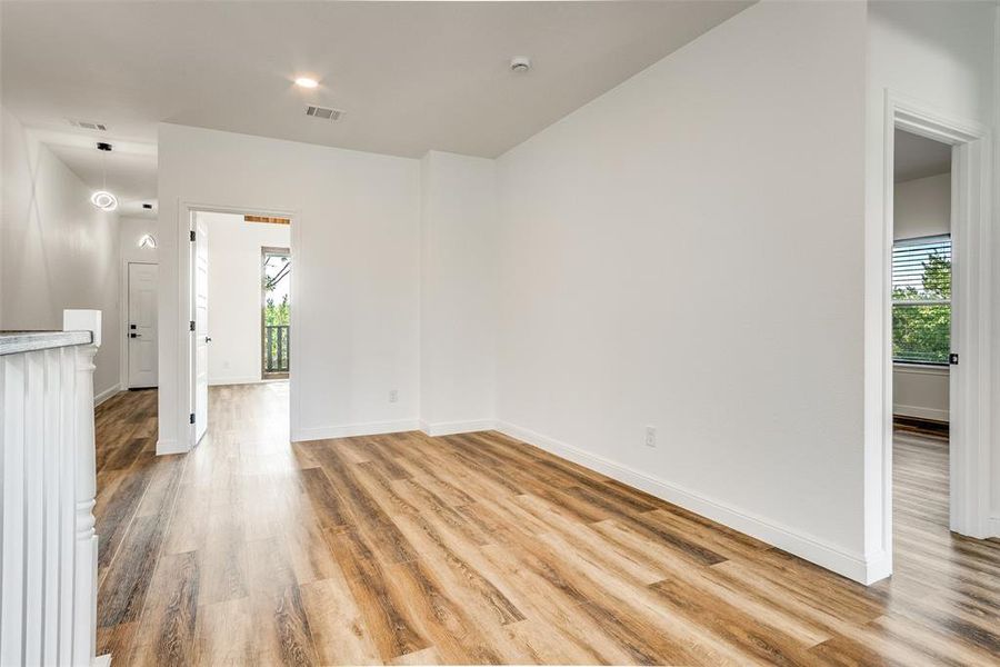 Unfurnished living room featuring light wood-style floors and recessed lighting