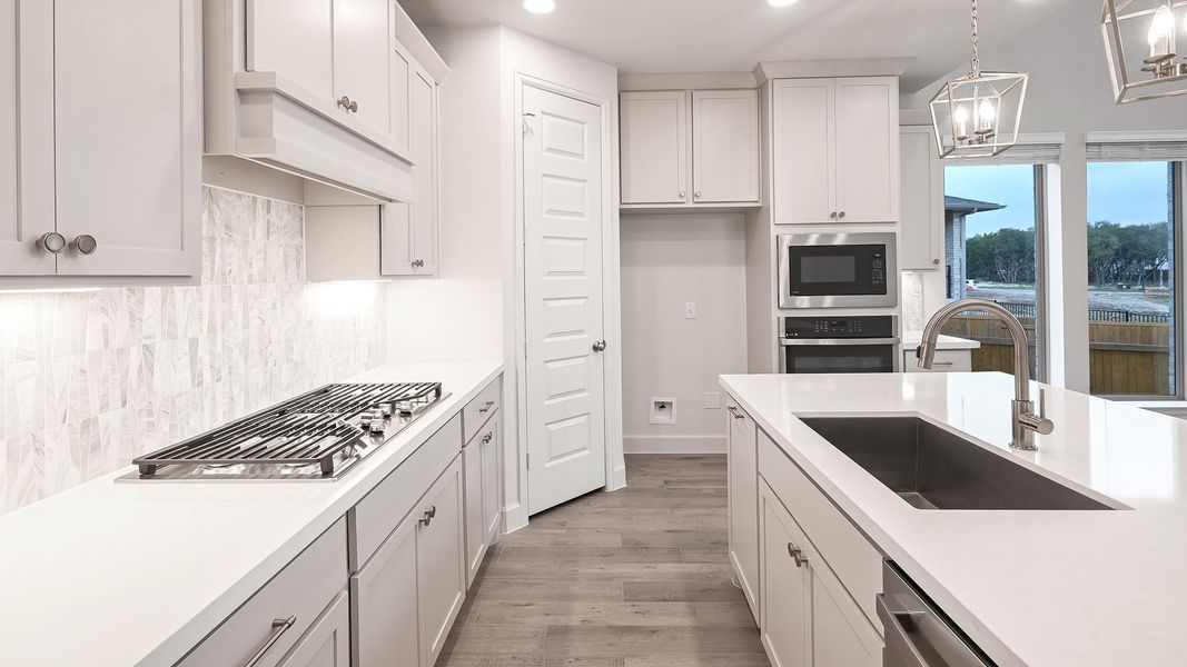 Furnished interior view inside a new home in 6 Creeks 50', Kyle (Image 5).