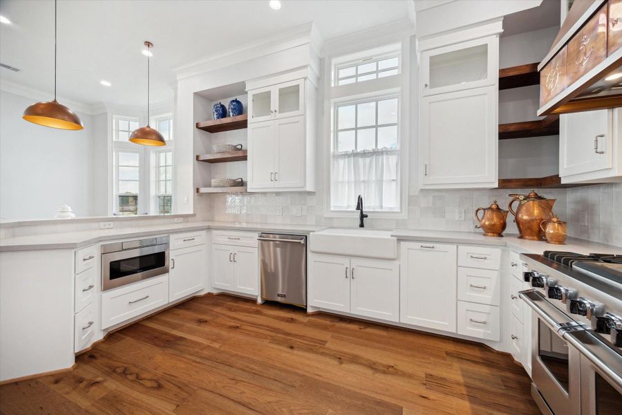 Beautiful kitchen with custom cabinetry. Plenty of storage with designer finishes. Beautiful kitchen with custom cabinetry. Plenty of storage with designer finishes.