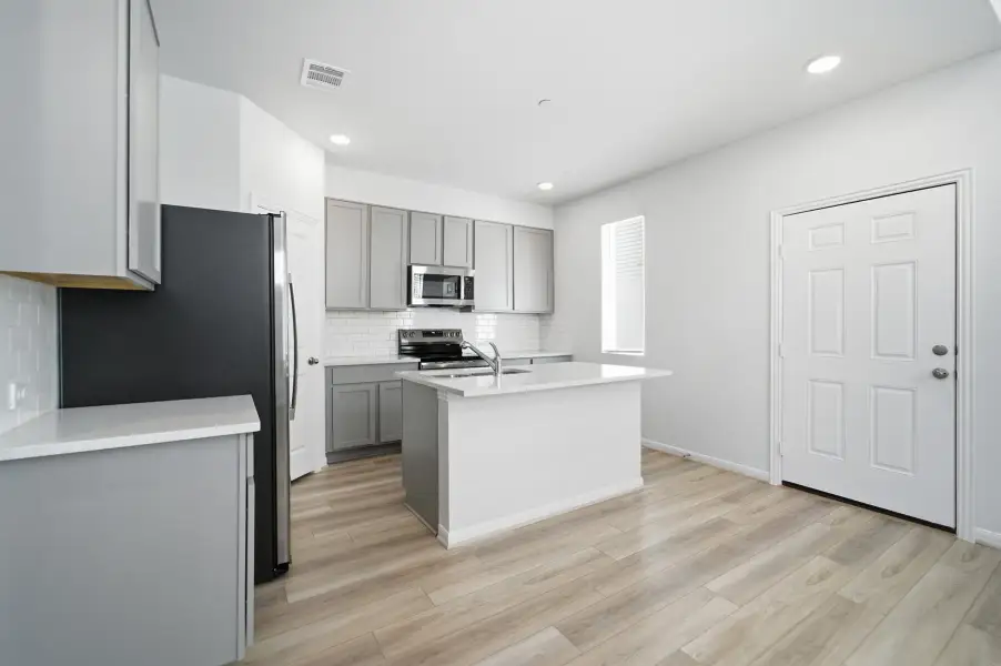 Furnished interior view inside a new home in Municipal Drive Townhomes, Leander (Image 15). Furnished interior view inside a new home in Municipal Drive Townhomes, Leander (Image 15).