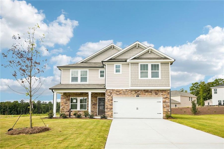 Front exterior of a new home in Northwoods at Mirror Lake, Villa Rica, GA, highlighting curb appeal (Image 2). Front exterior of a new home in Northwoods at Mirror Lake, Villa Rica, GA, highlighting curb appeal (Image 2).