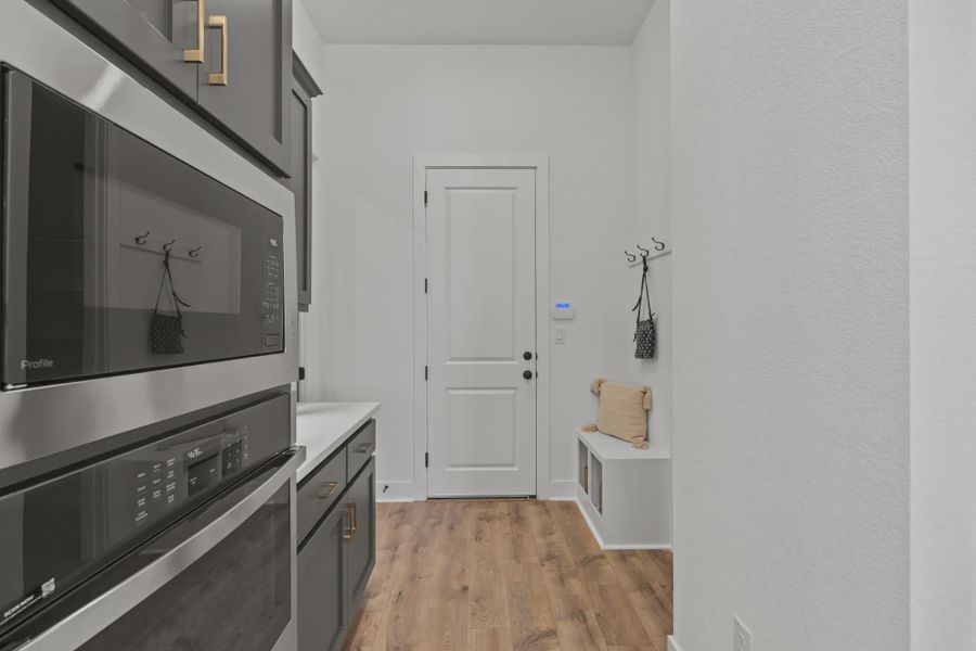 Representative furnished interior of a home built from the Silas by Chesmar Homes in 6 Creeks, Kyle (Image 8).