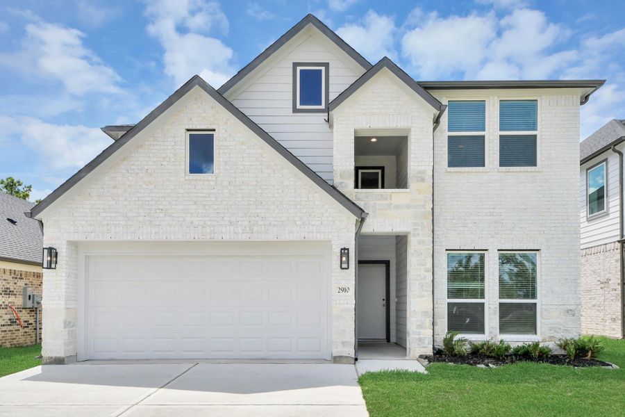 This home boasts lush green grass and meticulous landscaping. Its premium elevation showcases an exquisite blend of brick and stone features, complemented by modern coach lighting. This home boasts lush green grass and meticulous landscaping. Its premium elevation showcases an exquisite blend of brick and stone features, complemented by modern coach lighting.