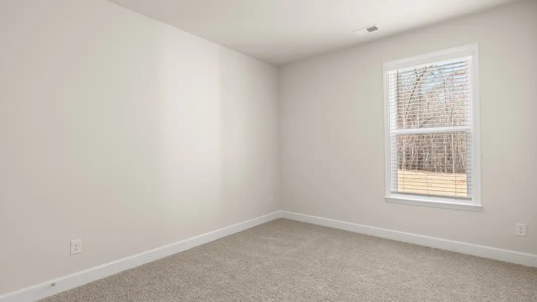 Representative unfurnished interior of a home built from the Hampshire by D.R. Horton in Heritage Pointe, Senoia (Image 24).