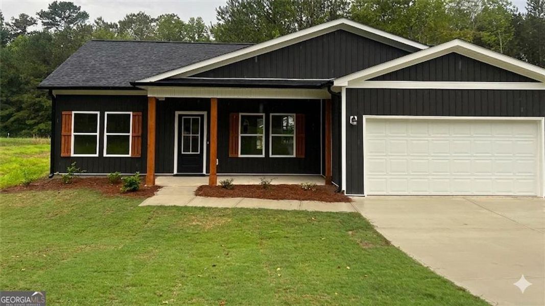 Front exterior of a new home in , Dallas, GA, highlighting curb appeal (Image 17).