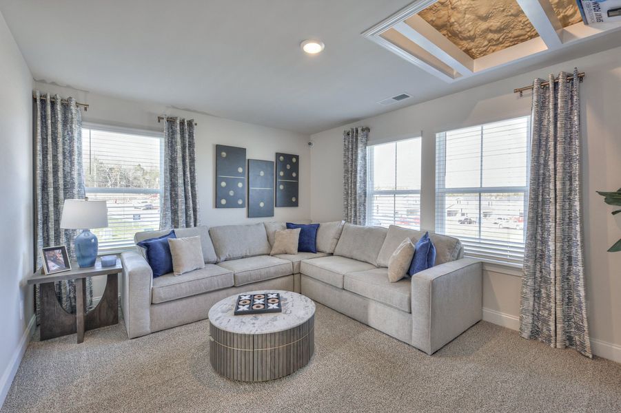 The upstairs lofts separates the secondary bedrooms from the primary suite.