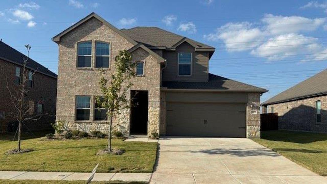 Front exterior of a new home in Fireside by the Lake, Garland, TX, highlighting curb appeal (Image 2).
