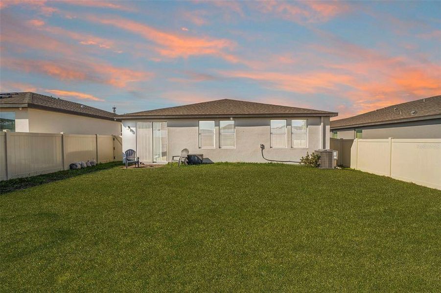 Exterior details and patio area of a home in Deer Run at Crosswinds, Davenport (Image 4).