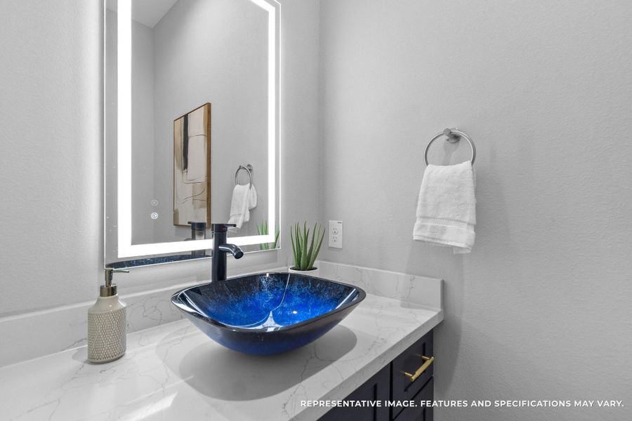 Your powder bath feels like a designer’s touch—every detail, from the glowing mirror to the deep blue vessel sink, makes even quick stops feel luxurious. Your powder bath feels like a designer’s touch—every detail, from the glowing mirror to the deep blue vessel sink, makes even quick stops feel luxurious.