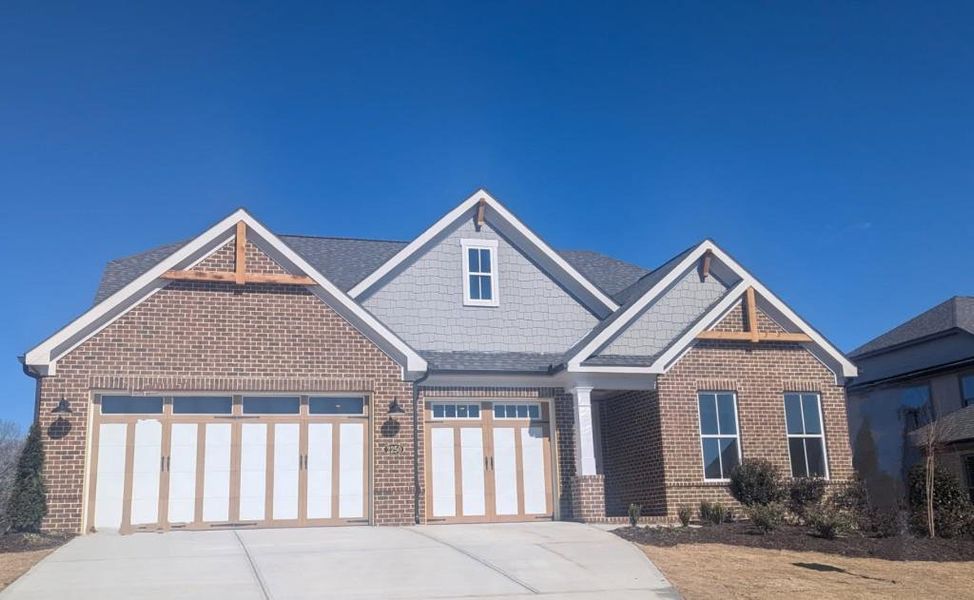 Front exterior of a new home in , Cumming, GA, highlighting curb appeal (Image 17).