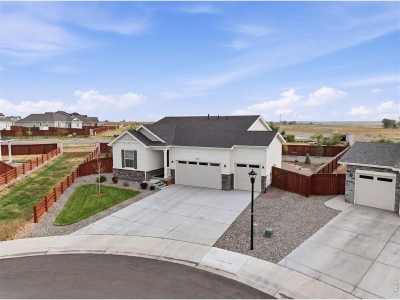 Front exterior of a new home in , Johnstown, CO, highlighting curb appeal (Image 23).
