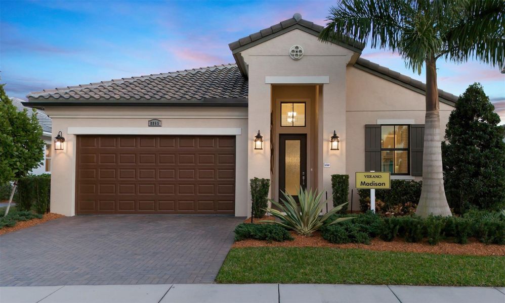 Front exterior of a new home in PGA Village Verano, Port St. Lucie, FL, highlighting curb appeal (Image 1).