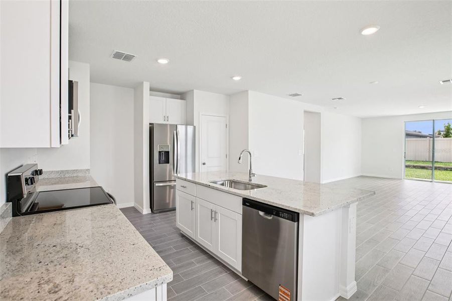 Furnished interior view inside a new home in Two Rivers - Premier Series, Zephyrhills (Image 7).