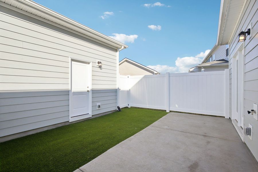 Exterior details and patio area of a home in Greystone - Vista Townhomes, Smyrna (Image 3).
