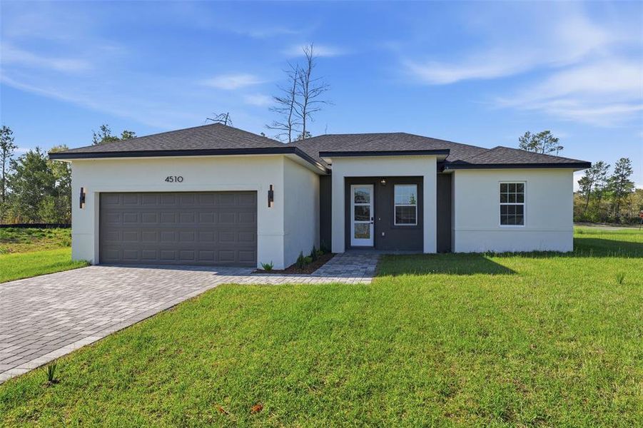 Front exterior of a new home in , Ocala, FL, highlighting curb appeal (Image 22).