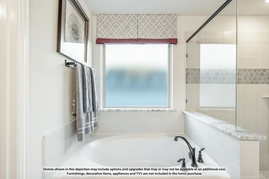Bathroom with soaking tub, glass shower enclosure, and frosted privacy window with decorative valance Bathroom with soaking tub, glass shower enclosure, and frosted privacy window with decorative valance